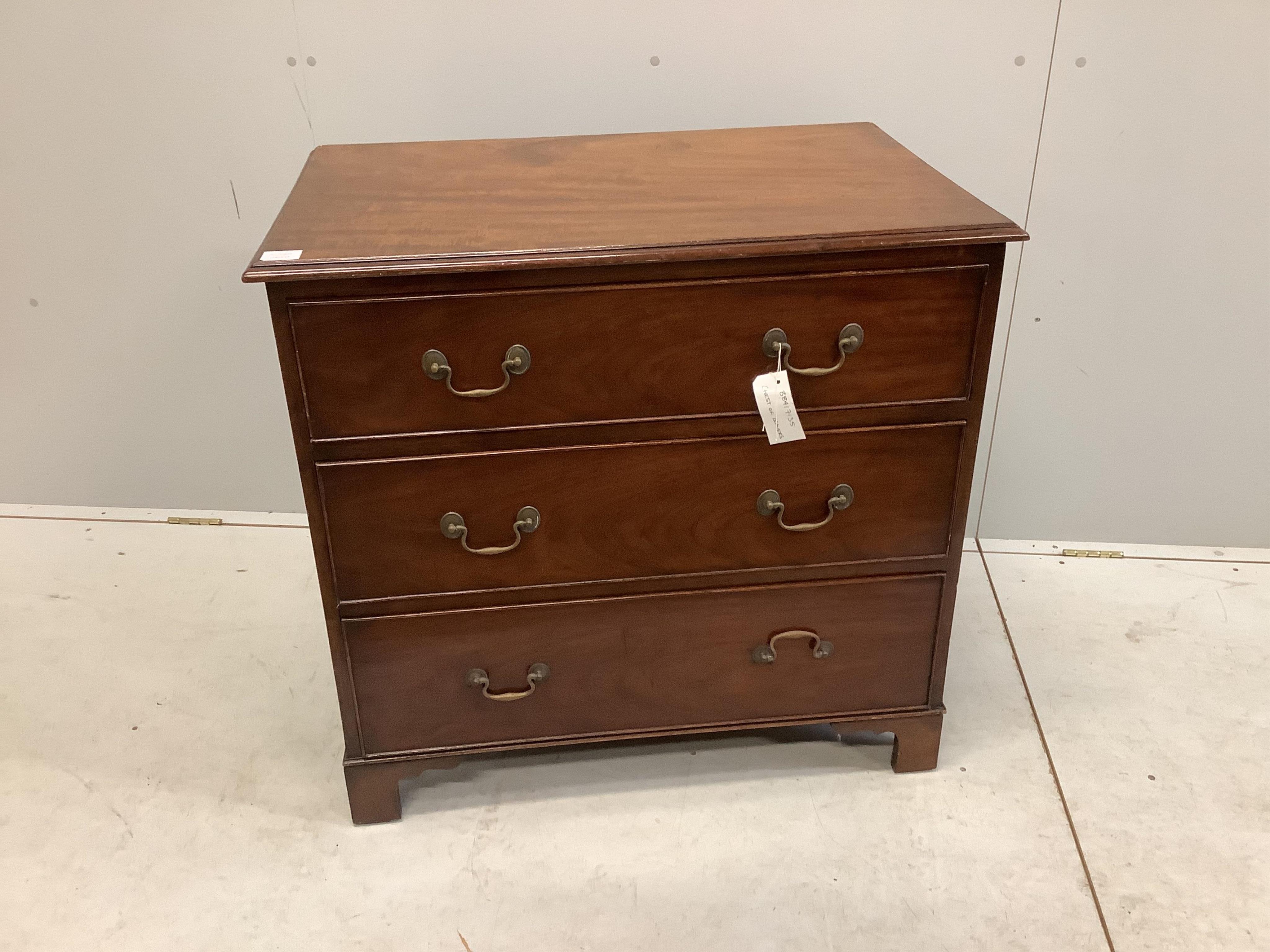 An early 20th century mahogany chest with a moulded top, three long drawers with brass loop handles and bracket feet, width 86cm, depth 56cm, height 82cm. Condition - fair to good